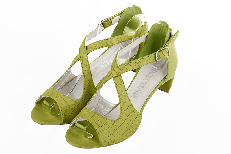 Pistachio green women's closed back sandals, with crossed straps. Round toe. Low comma heels. Front view - Florence KOOIJMAN